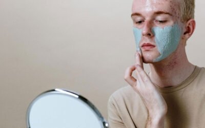 man putting face cleanser