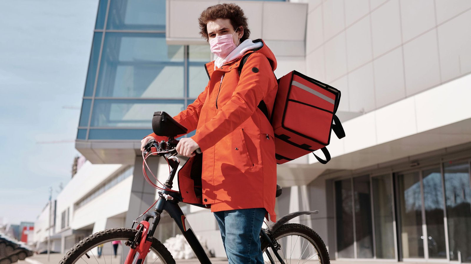 man delivering food on bicycle